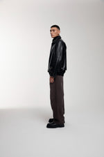 Boxy Hiker Leather Jacket in black worn by male model