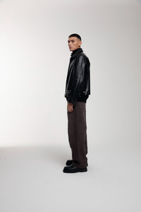 Boxy Hiker Leather Jacket in black worn by male model