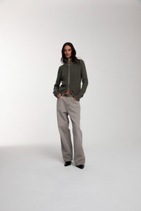 Engineered Zip Cardigan in Dusty Olive and Trace Cut Denim Jeans in Vintage Khaki worn by female model