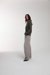 Engineered Zip Cardigan in Dusty Olive and Trace Cut Denim Jeans in Vintage Khaki worn by female model