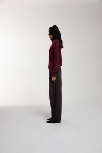Engineered Zip Cardigan in Oxblood and Trace Cut Denim Jeans in Chocolate Brown worn by female model