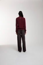 Engineered Zip Cardigan in Oxblood and Trace Cut Denim Jeans in Chocolate Brown worn by female model