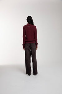 Engineered Zip Cardigan in Oxblood and Trace Cut Denim Jeans in Chocolate Brown worn by female model