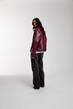 Boxy Hiker Leather Jacket in oxblood worn by female model