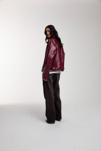 Boxy Hiker Leather Jacket in oxblood worn by female model