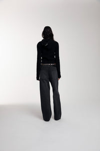 Frame Knitted Hoodie in Black worn by female model