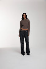 Frame Knitted Hoodie in Bungee Cord worn by female model